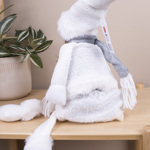 игрушка из ткани-девочка в белом свитере с мягкими ногами.