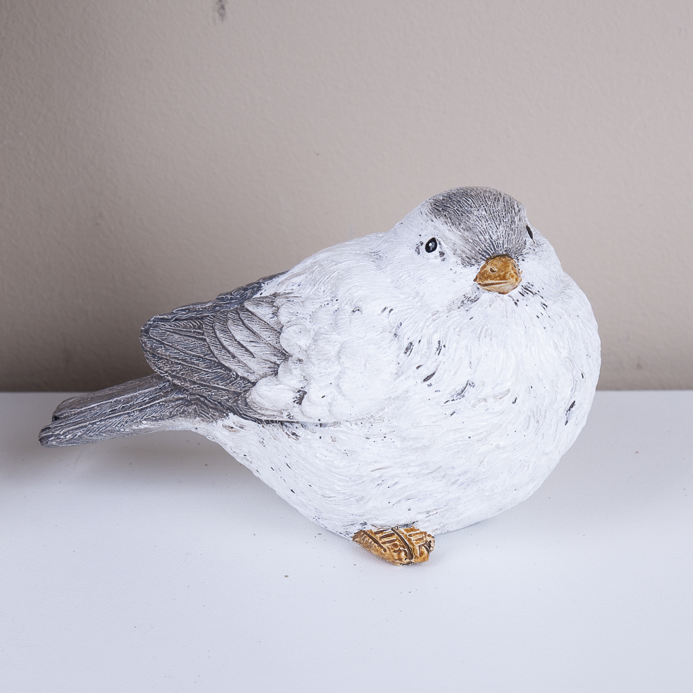 статуэтка птица голова на бок